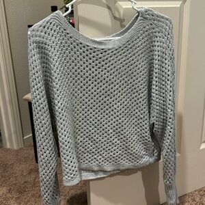This is a super cute top if you wear a black tank underneath. Grey/silver…